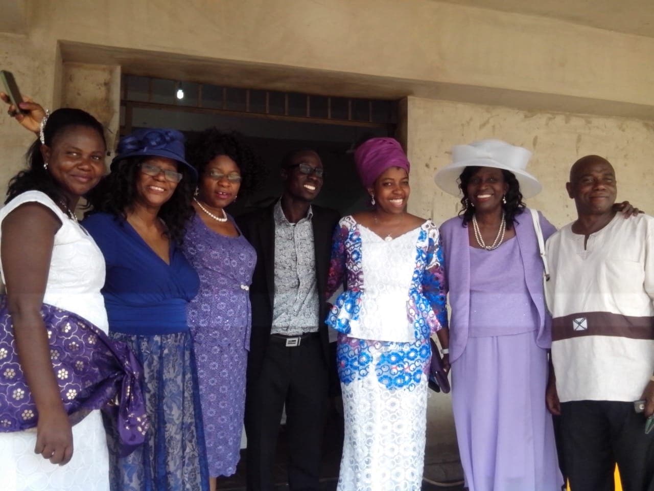Ebenezer standing with family members at a gathering