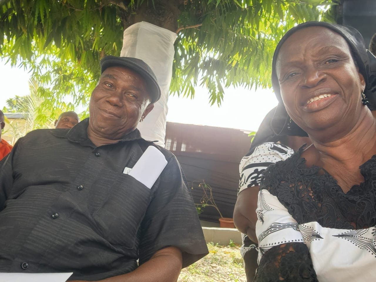 Ebenezer smiling at an outdoor gathering